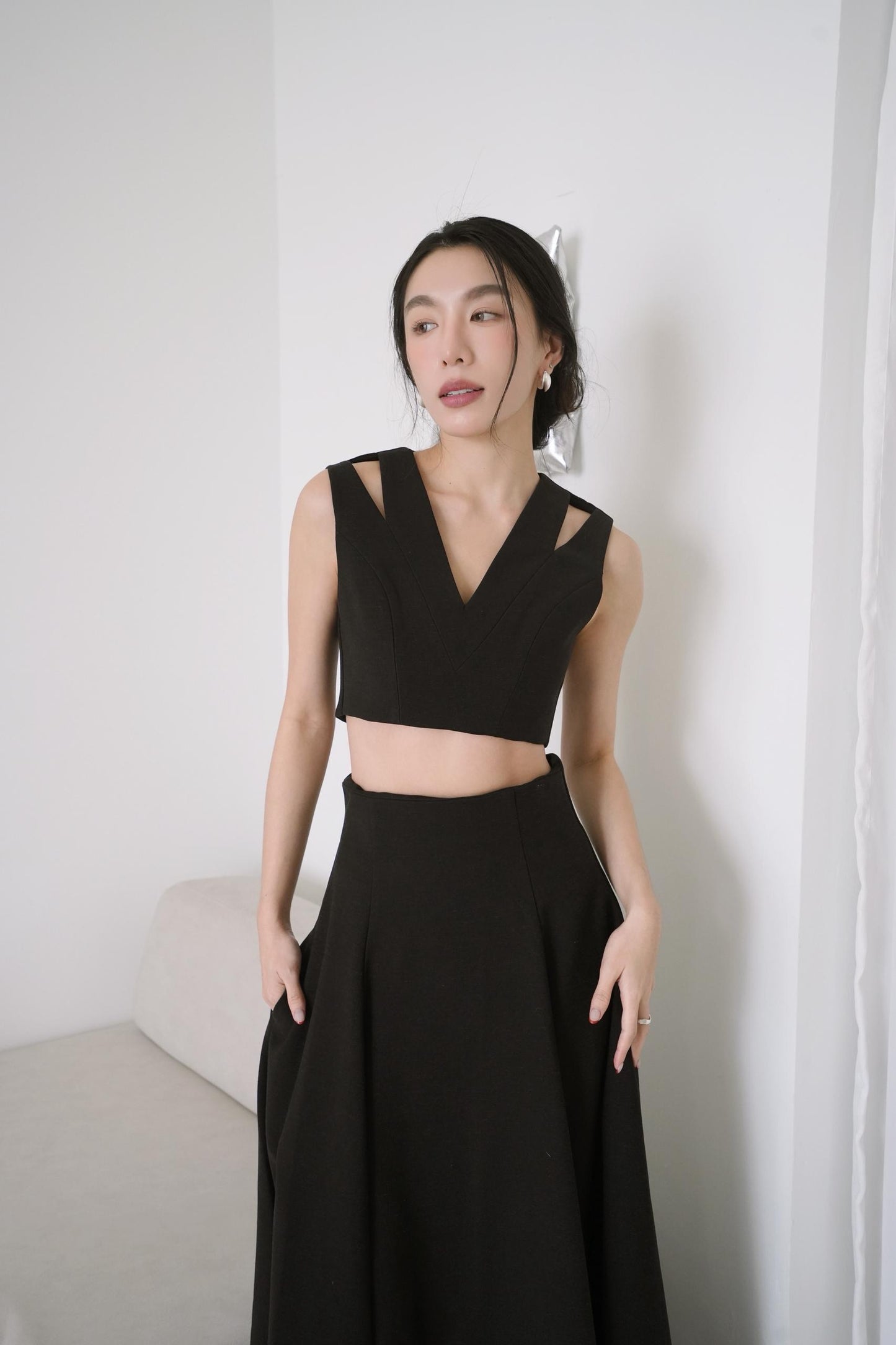 Sleeveless Cutout Top With A line Draped Long Skirt