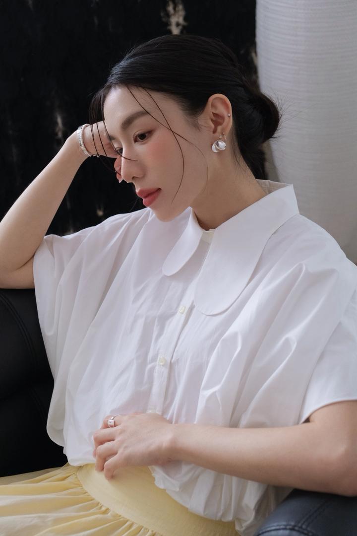 Round asymmetrical neckline shirt