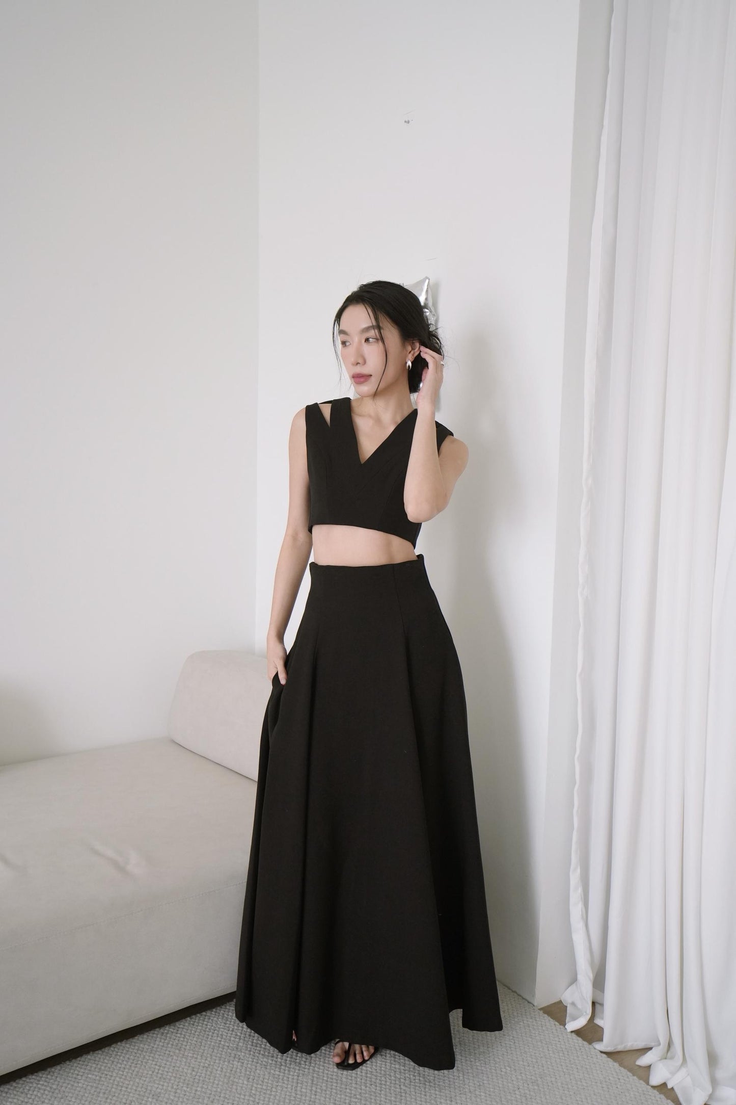 Sleeveless Cutout Top With A line Draped Long Skirt
